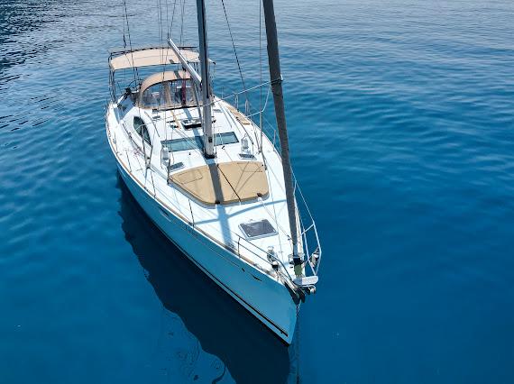 White sailboat on deep blue Adriatic waters