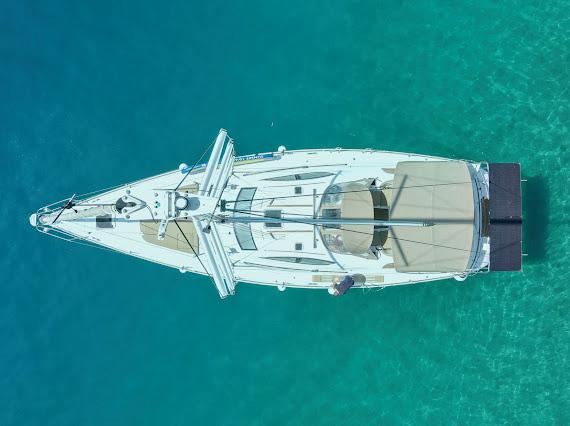 Bird's-eye view of yacht on clear turquoise Adriatic